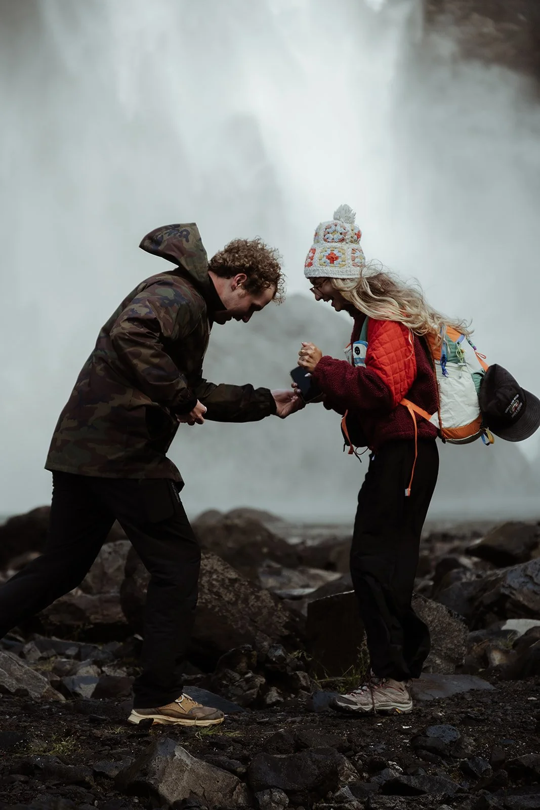 couple getting engaged during a Háifoss waterfall hiking adventure