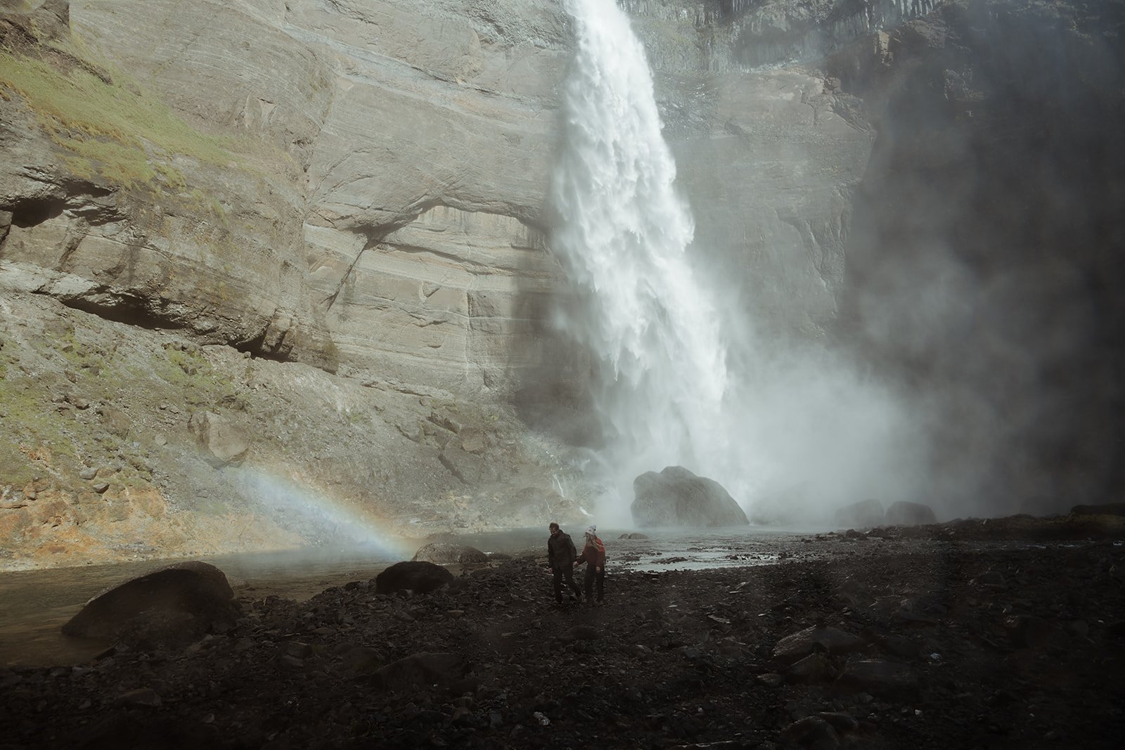 couple walking through the Háifoss landscape after their Iceland proposal