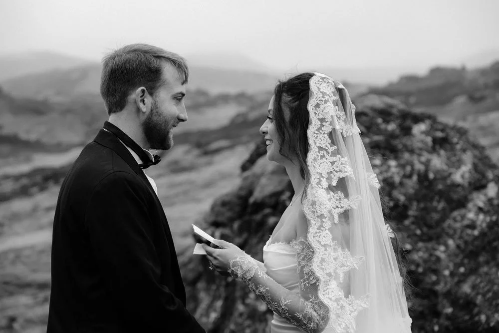 bride reading vows during private Iceland elopement