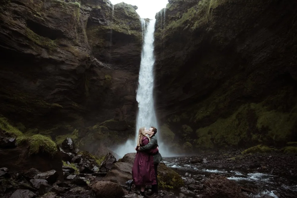 Newly engaged couple at Kvernufoss waterfall in early August