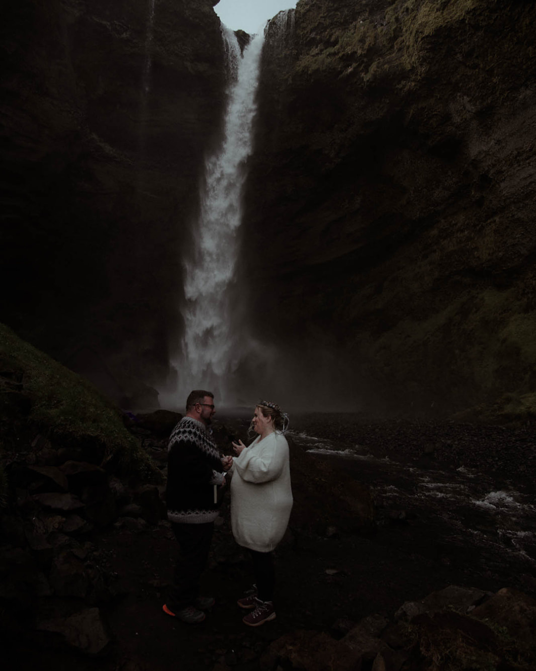 an elopement ceremony by a waterfall