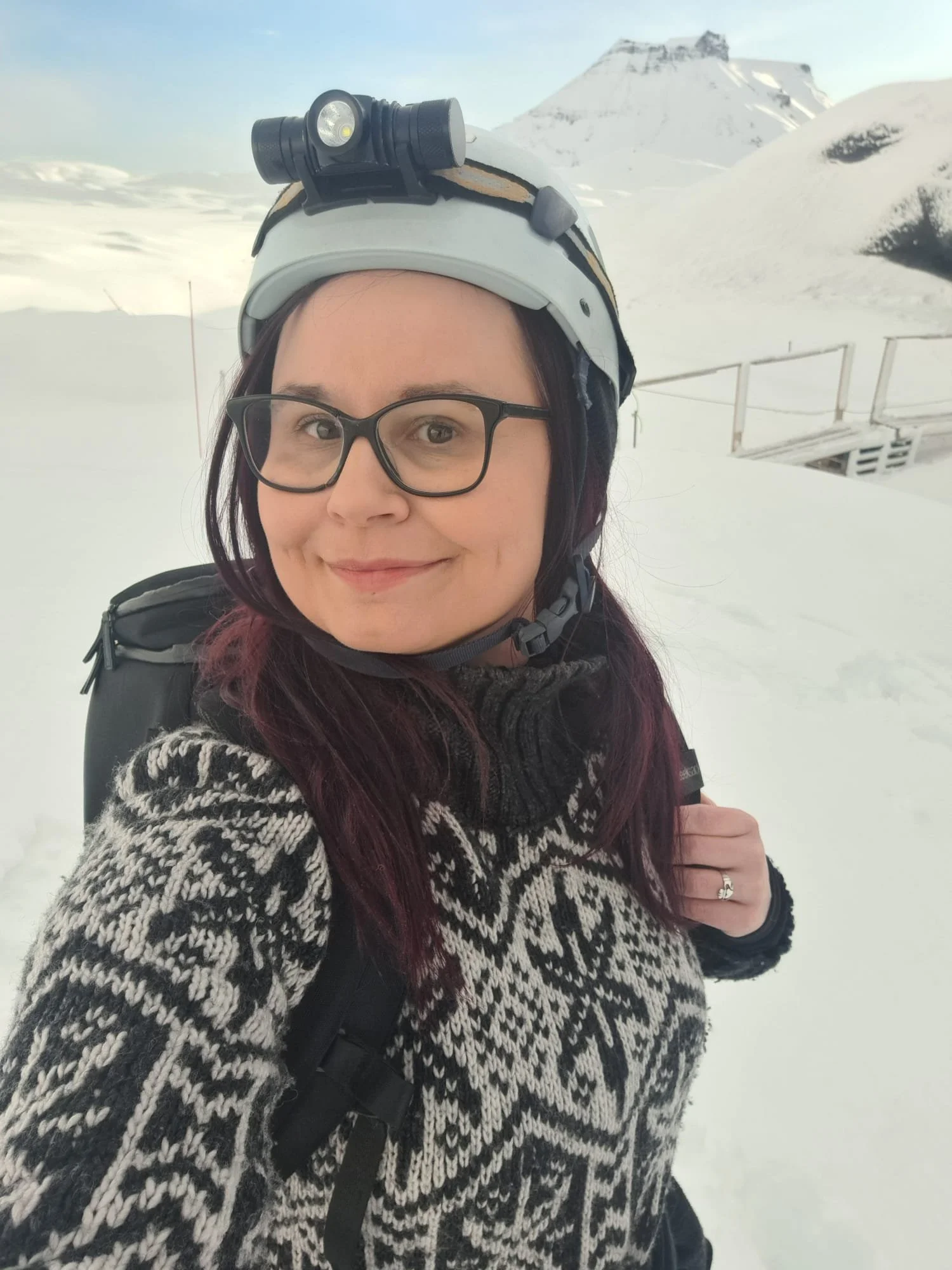 Lisa McWhirter wearing glacier safety gear while exploring a snowy landscape in Iceland.