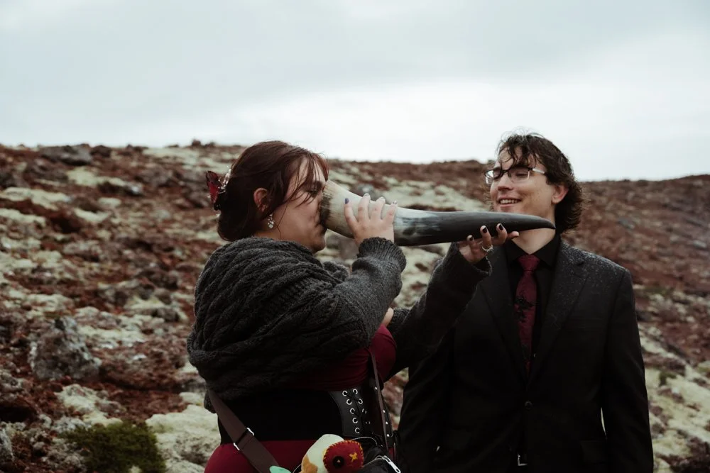 Chey and Joe celebrating after becoming husband and wife during Iceland's solar eclipse.