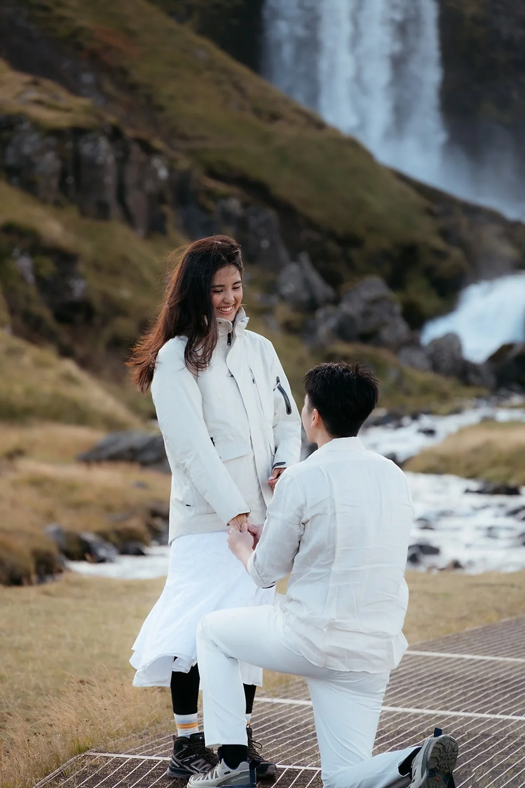 Luke proposing to Euphrasia at Svöðufoss waterfall in Iceland