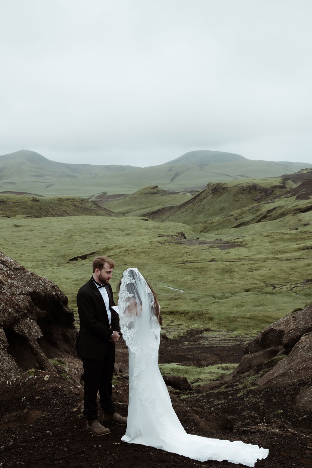 couple exchanging private vows during Iceland elopement
