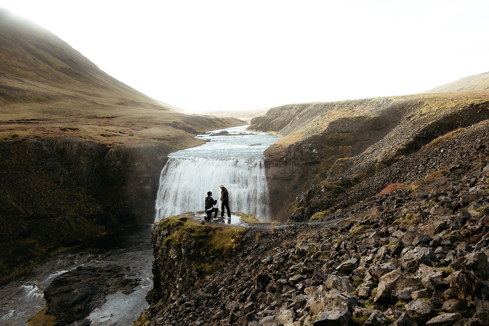 Tyler proposing to Madison beside Þórufoss waterfall near Reykjavík Iceland