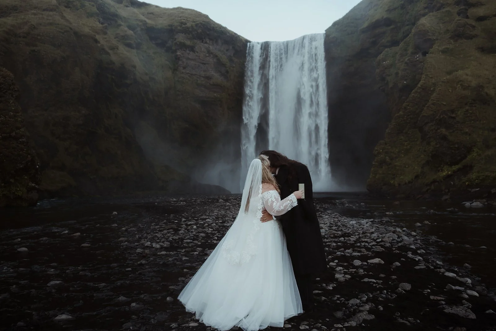 Couple embracing after exchanging their vows in South Iceland