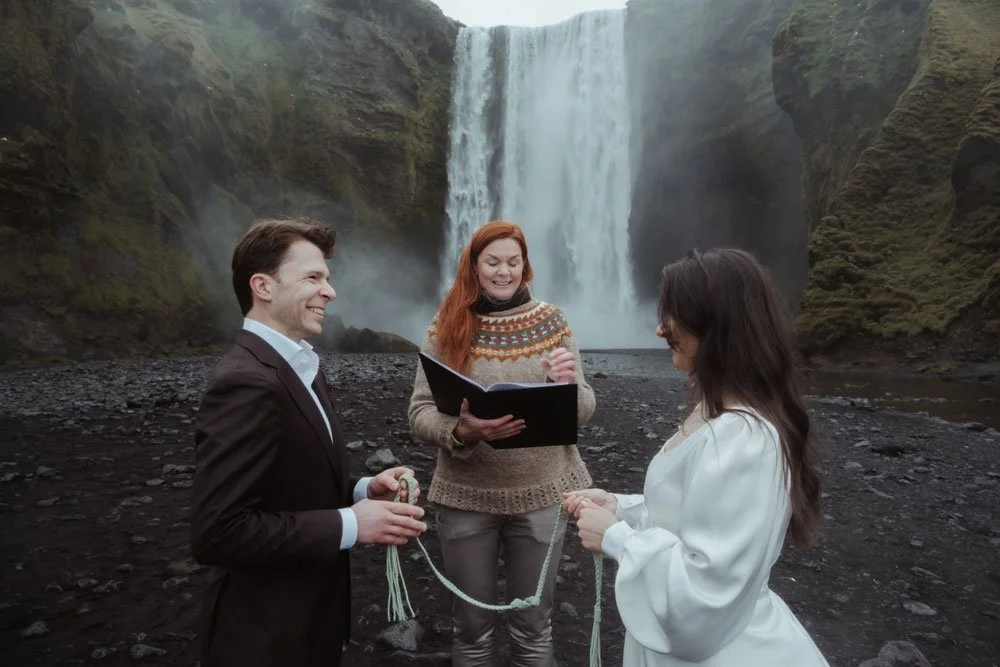 quiet morning ceremony at Skogafoss in Iceland