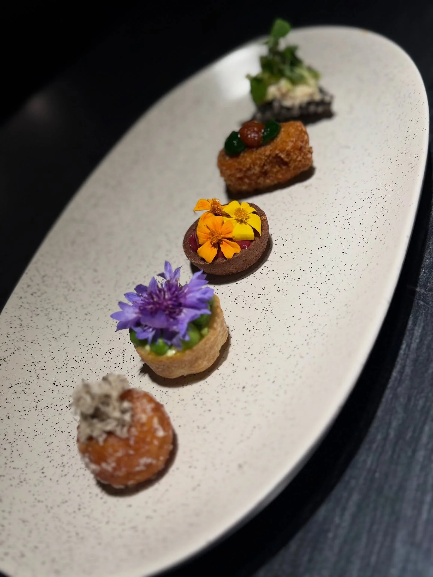 This weeks canape menu featuring seasonal favourites, colourful light bites and indulgent sweet treats.

From top to bottom: 

Squid ink cracker with Dorset crab, lime and lemon balm 🦀

Lamb shoulder croquette, smoked spices and wild garlic 🐑

72% 