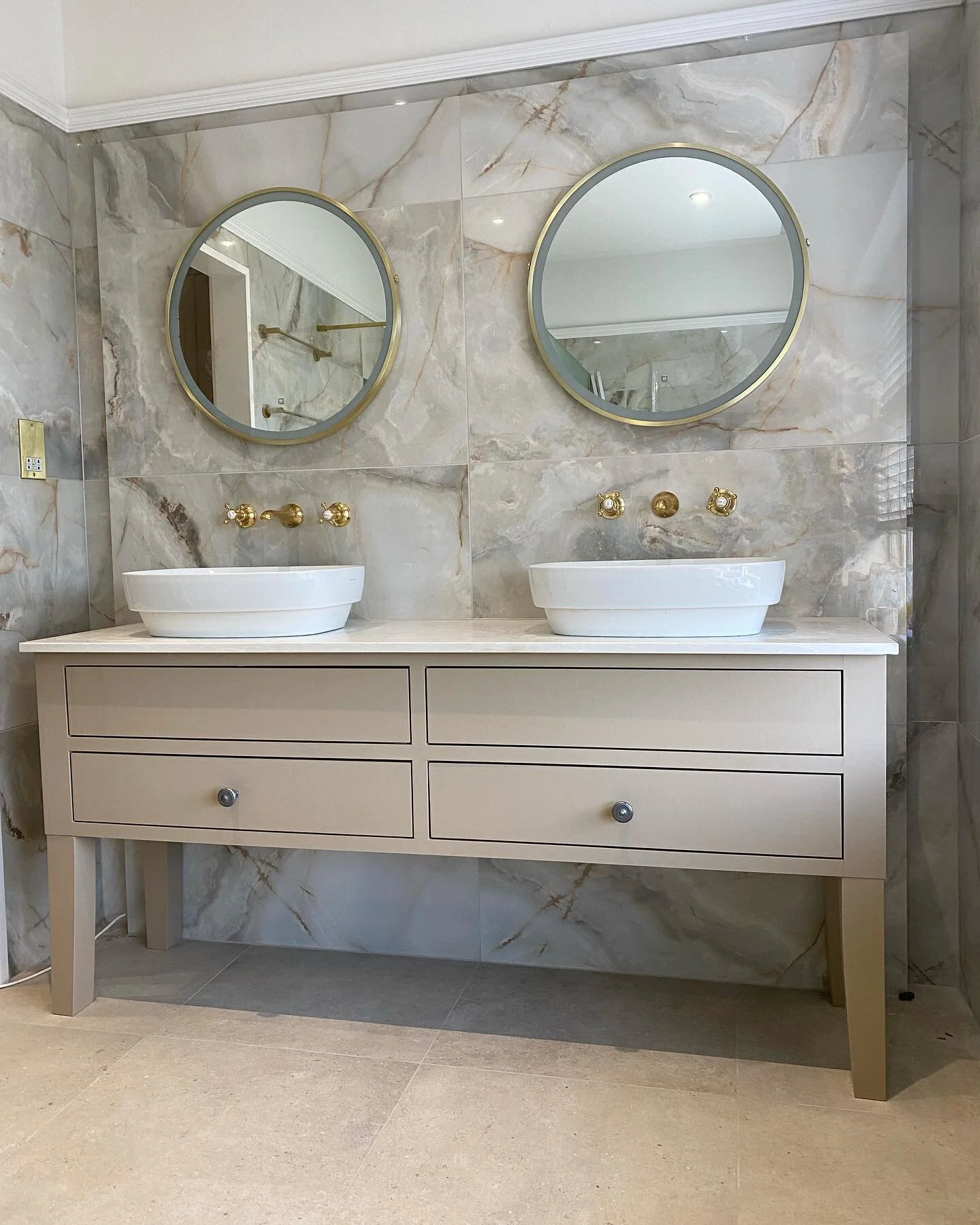 This stunning freestanding vanity unit was designed for a his and hers basin. Made from solid Maple and sprayed in Farrow & Ball - London Stone, finished with a White marble top. Interior drawers underneath finished in Truffle Brown Oak. #Vanity