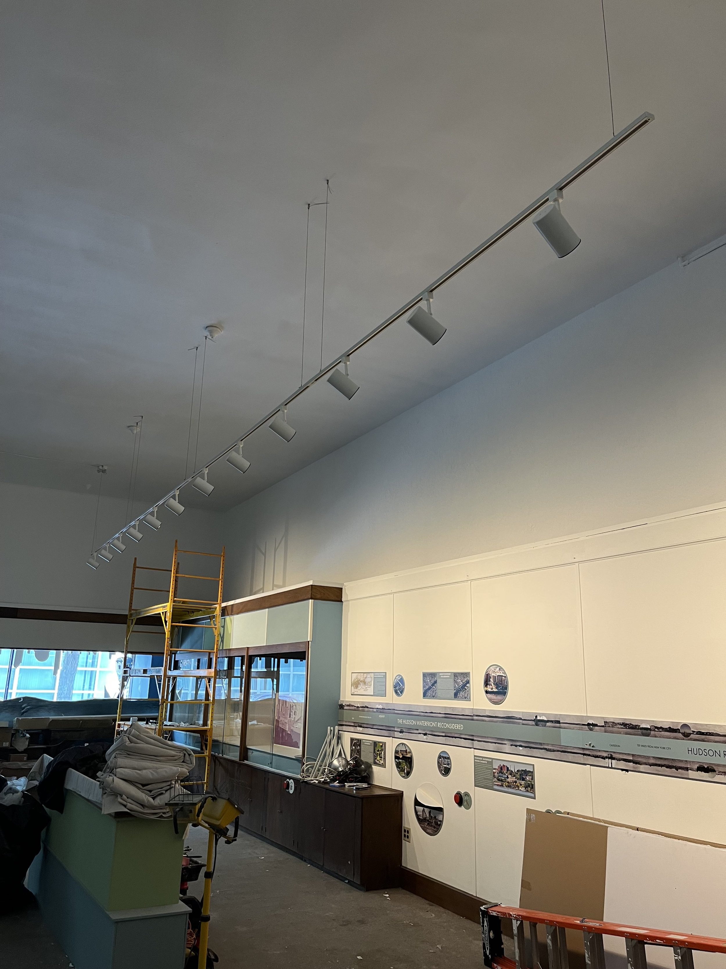   Drop ceilings were removed. Original 15’ ceiling were re-plastered. Lights were hung.  