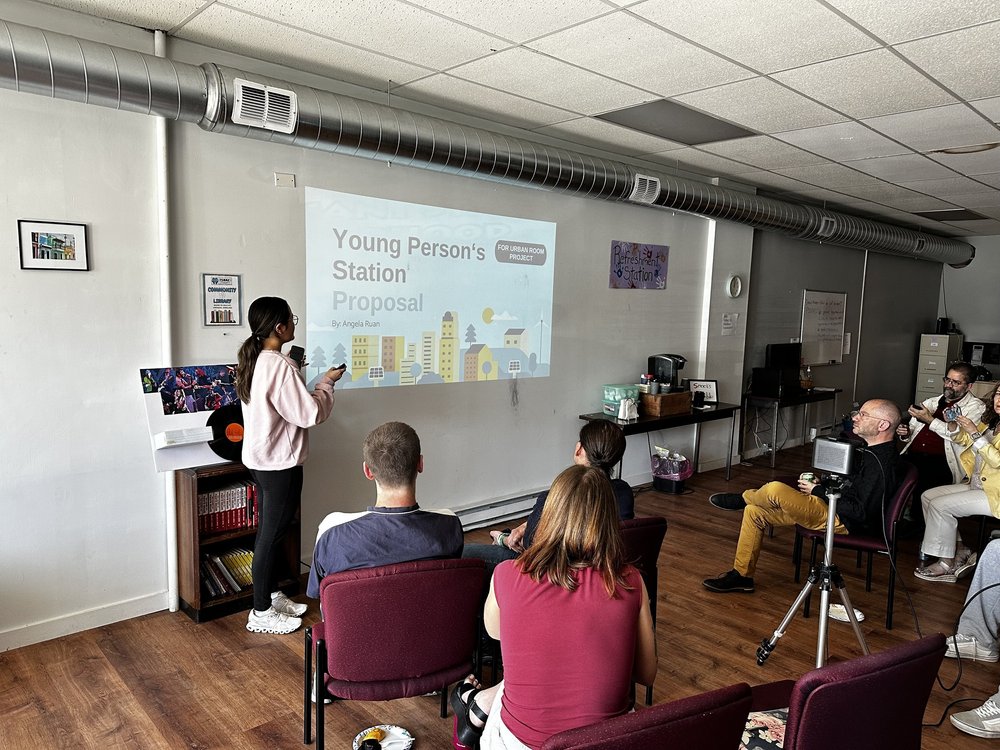   Clark student Angela Ruan presents on her Young Person's Station proposal for the future Urban Room.  