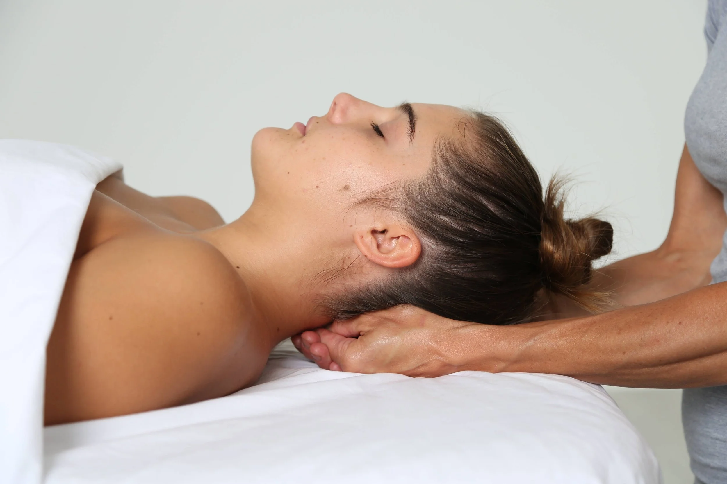 Person receiving craniosacral therapy