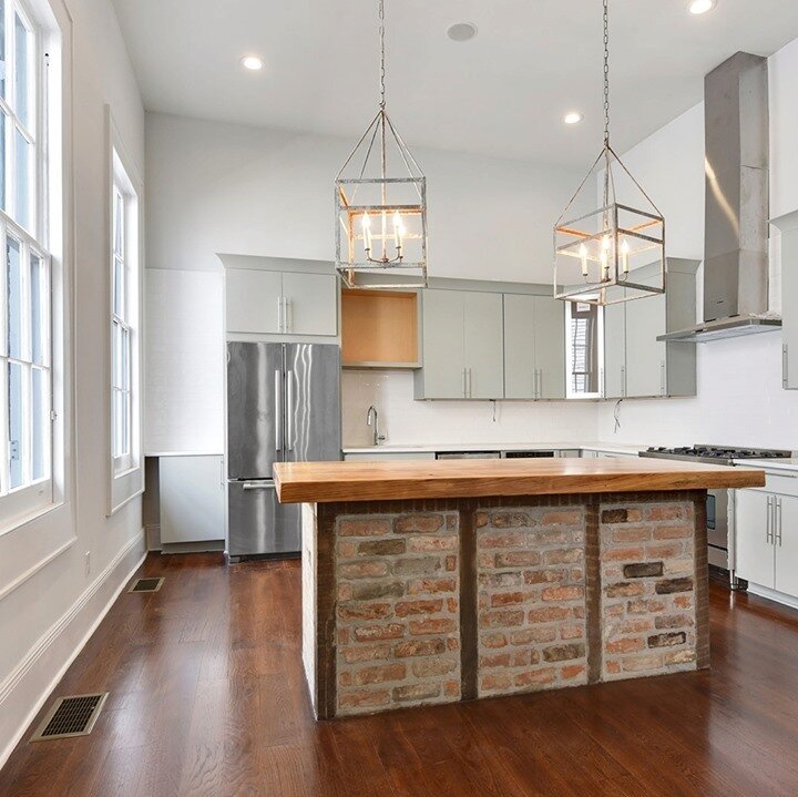 It's kitchen week!  We love a sneak peek of uncovered brick.