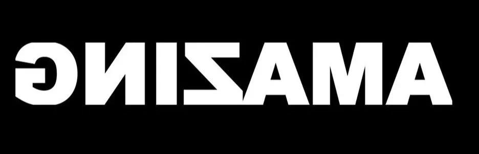 The word 'AMAZING' written in bold white capital letters on a black background, with the image flipped backwards.