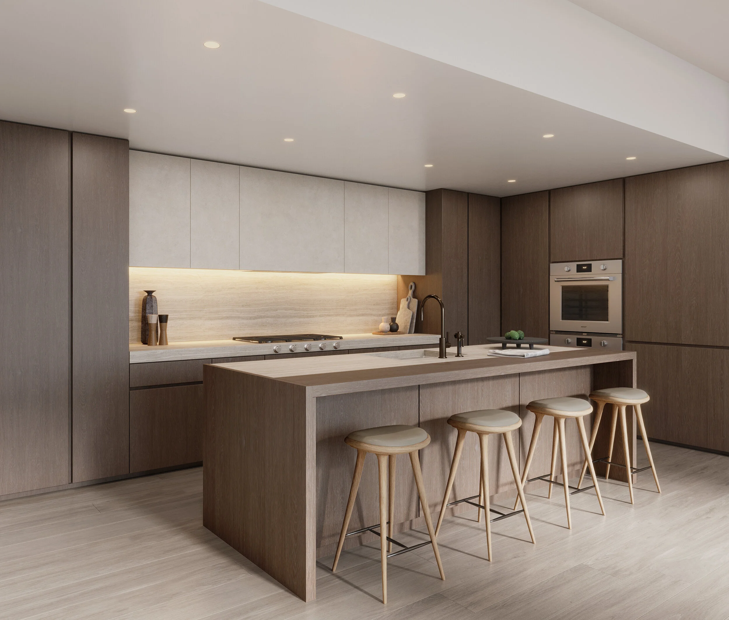 Modern kitchen with wood and beige cabinets, island with bar stools, and built-in oven.