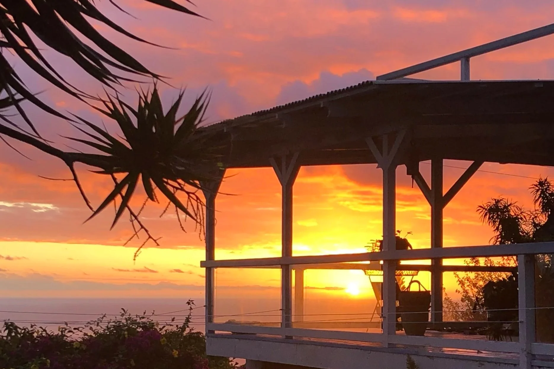 Sunset ocean view from the patio at Paliuli Farm Sanctuary, sacred retreat center on the Kona coast, Big Island Hawaii