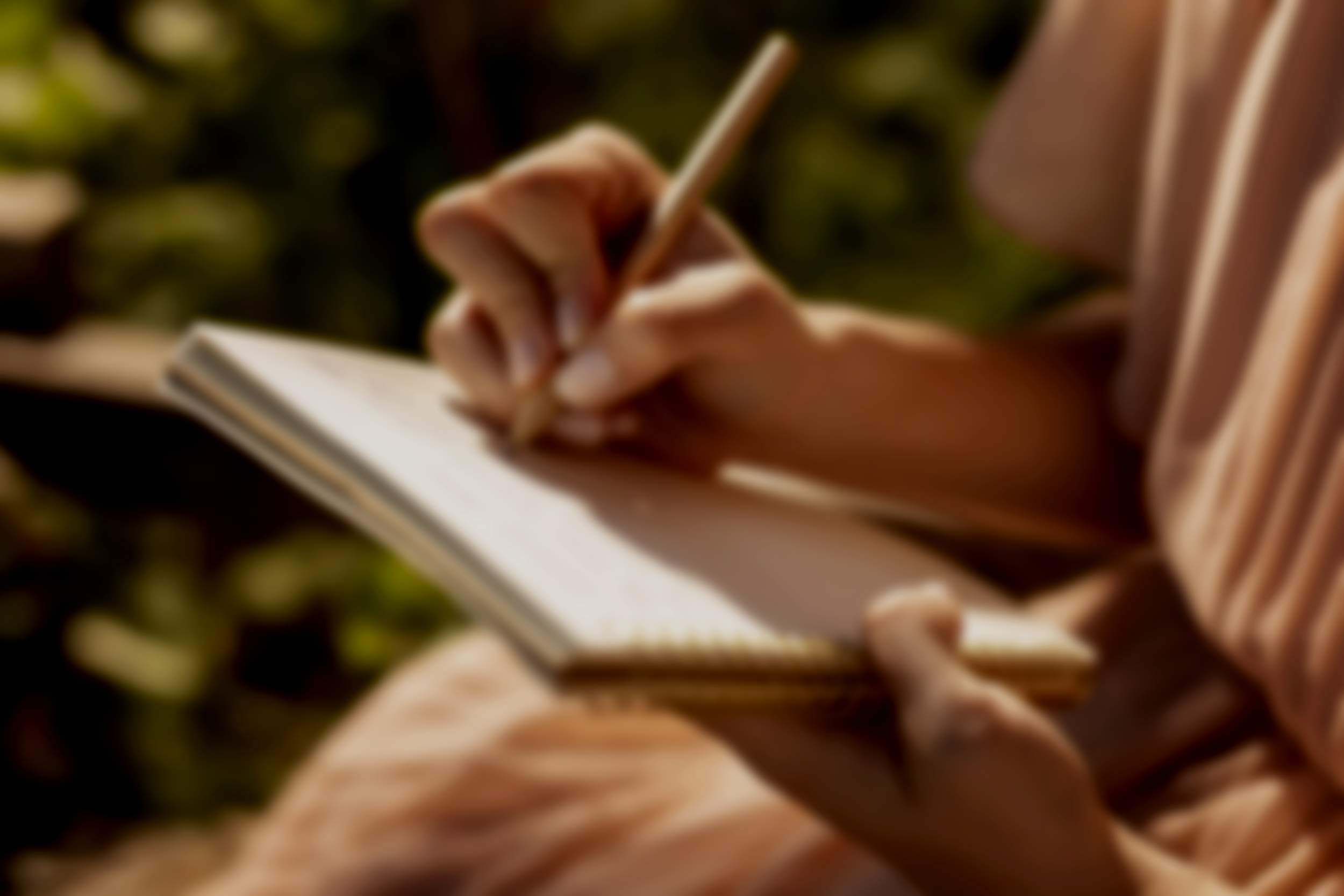 hand-writing-notebook-close-up.jpg.png