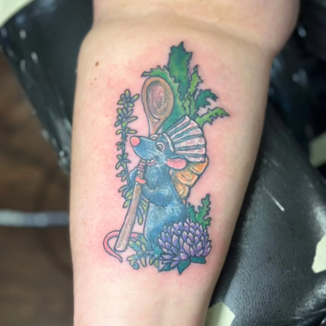 Out with the old, in with the new! 🐭🥘

We just finished this killer coverup for Missy, turning an old piece into everyone's favorite "Little Chef." This vibrant Remy from Ratatouille is ready to whip up something special, complete with hi