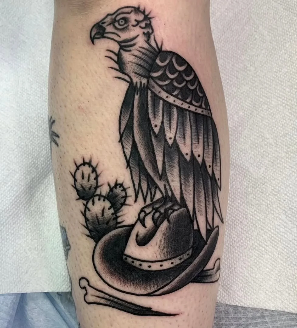 Zack recently completed this killer traditional blackwork vulture piece! This grim scavenger is perfectly perched on a detailed cowboy hat, looking out over the desert landscape. It&rsquo;s accompanied by a small, spiky cactus, creating an atmospheri