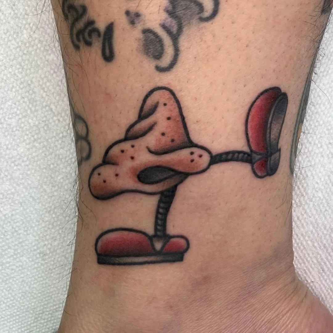 Zack zapped out this incredibly playful neo-traditional piece featuring a stylized anthropomorphic nose kicking out with one leg! It&rsquo;s a perfect example of how even the most unusual ideas can make for a fun and striking tattoo!

Whether you hav
