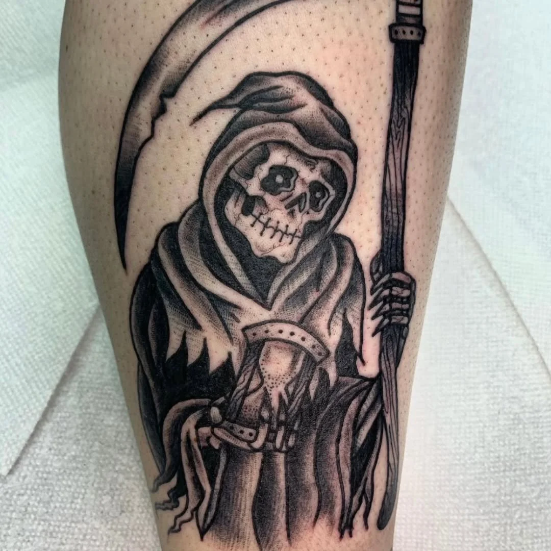 Zack tatted this "killer" traditional Grim Reaper ankle piece. This design features the hooded specter clutching a large scythe and holding an hourglass.

Whether you are looking for classic macabre imagery, a custom traditional piece, or h