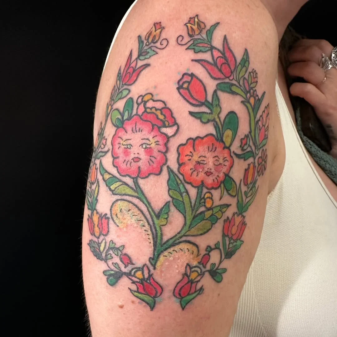 While the world at large is busy being self-serious, we like to inject bright and colorful fun into our drearier days. This lovely pair of flower ladies for Mel is a prime example, Kelly's use of rich colors, the inclusion of rosy cheeks, and just th