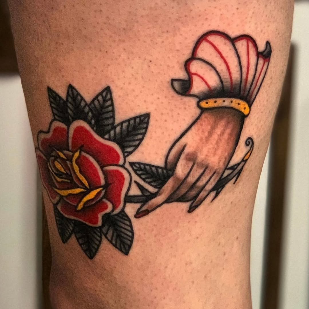The deep red color of the long-stem rose being held by this perfectly shaded hand really pops. Zack packs so much color into his traditional tattoos, and this is just another example of how well it pays off! 🥀🪵🔥

Whether you are looking to start a