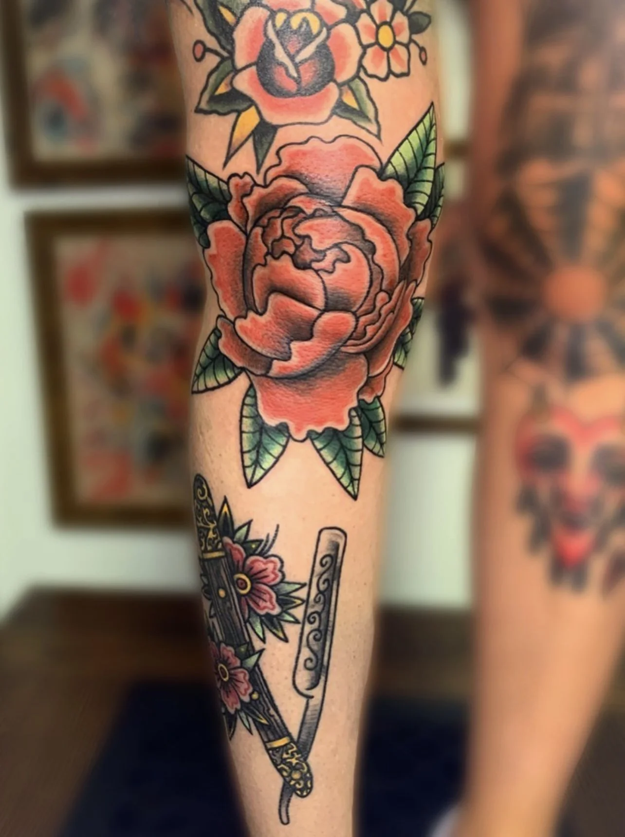 Traditional Rose Tattoo on the front of a leg.