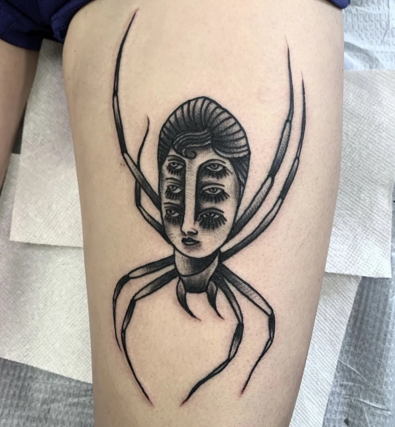 Blackwork multi-eyed head on spider body