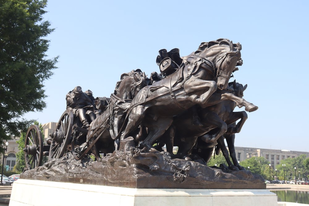 Lots of statues of soldiers at war.