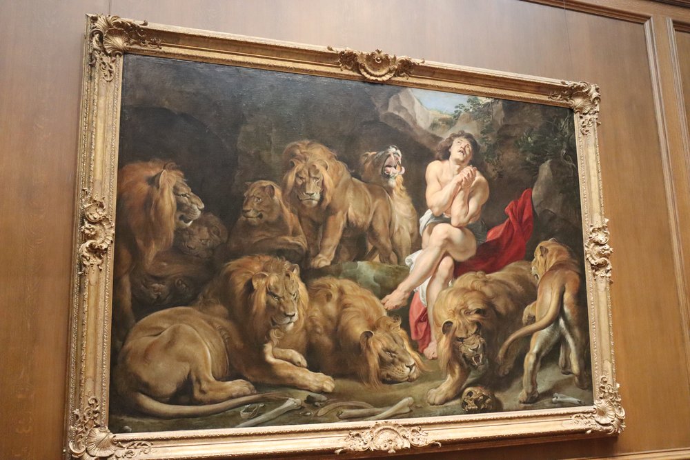 A huge painting of Daniel in the lion's den.