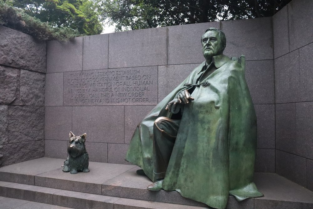 FDR and his dog Fala. The cloak was to hide his chair.