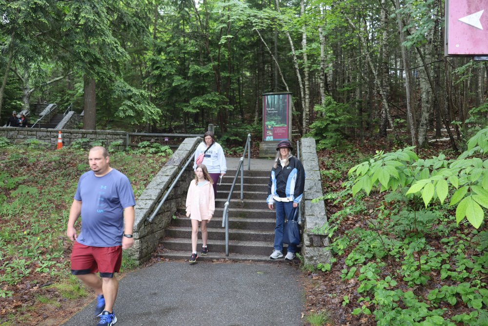 Mavis (in the maroon hat and blue &amp; white jacket) on the entrance to Acadia Visitor Center--32 steps.