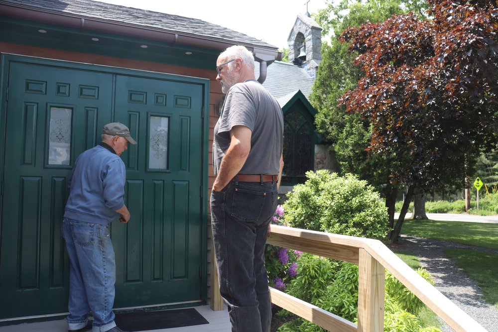 The caretaker letting us in.