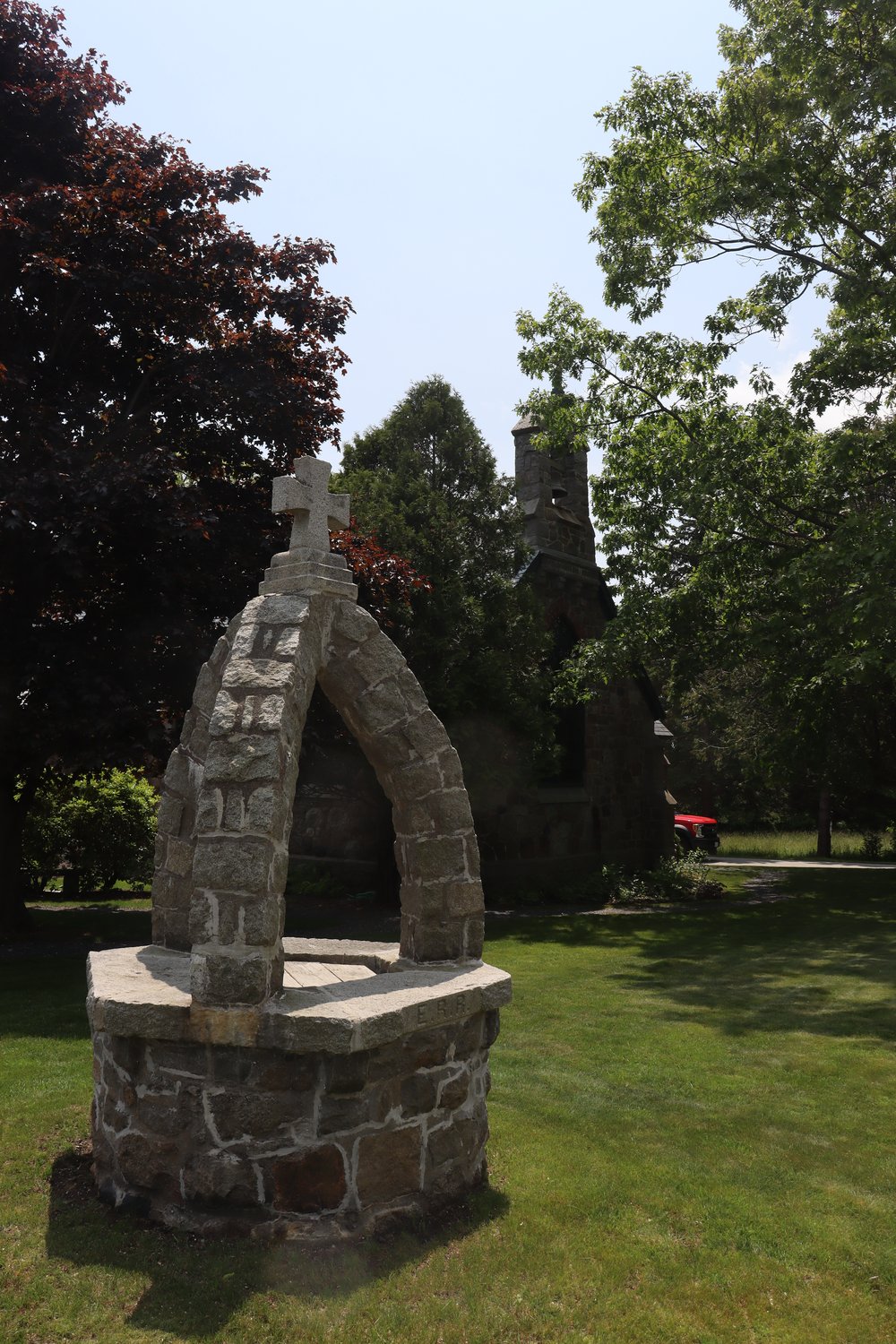 The stone marker in front.