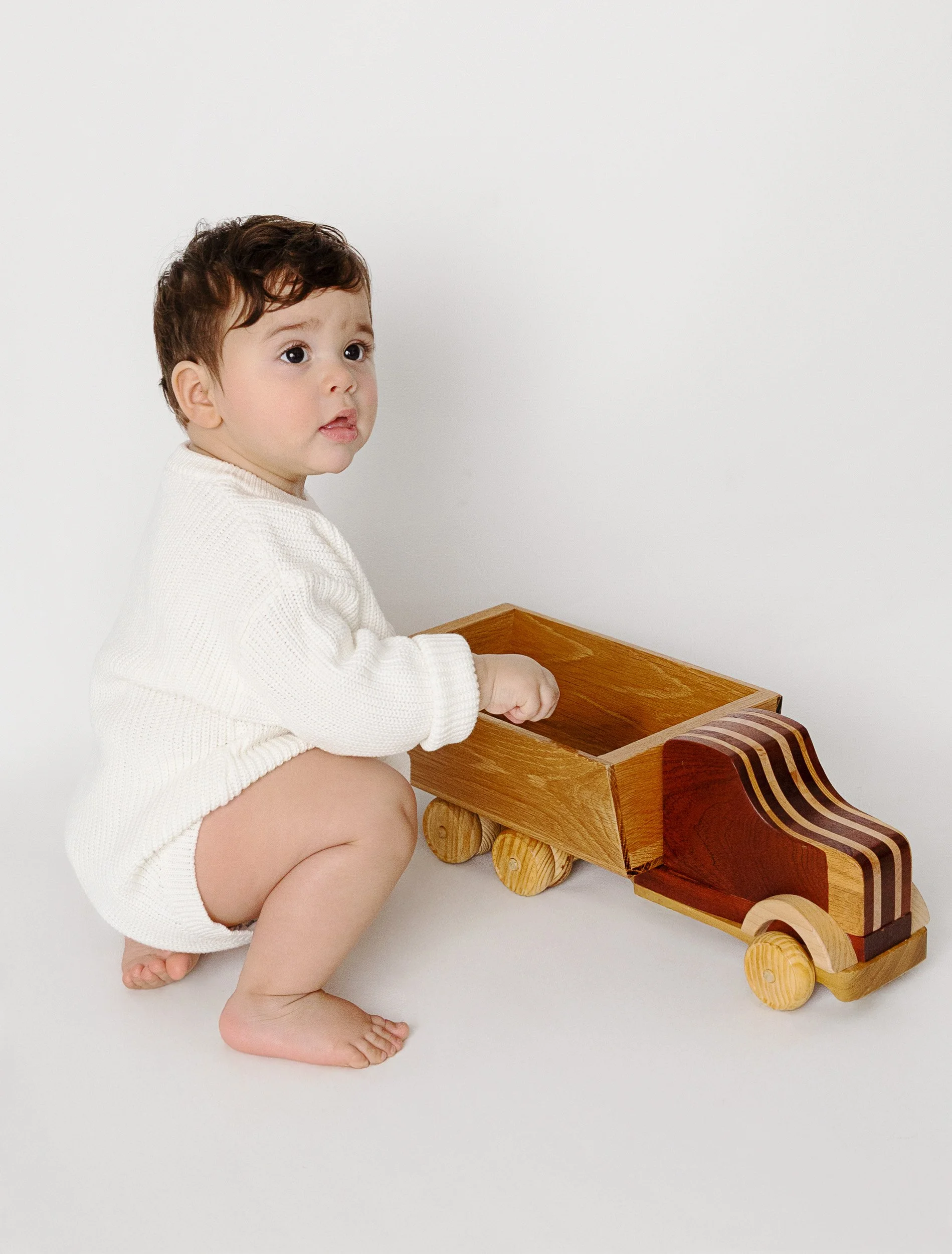 Simple and timeless first birthday portraits taken in-home in Odessa