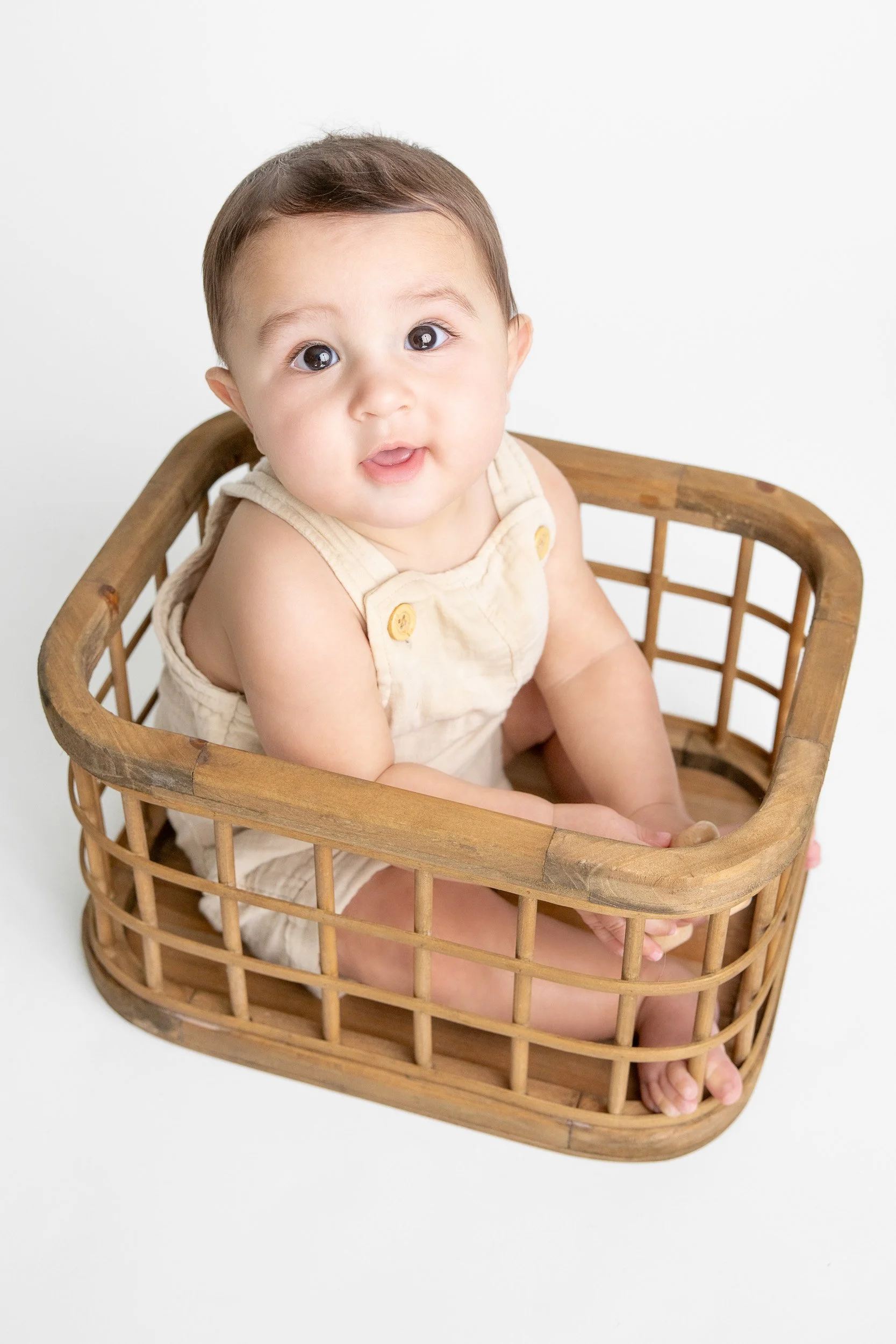 In-home 6 month baby photos capturing sitter stage milestones