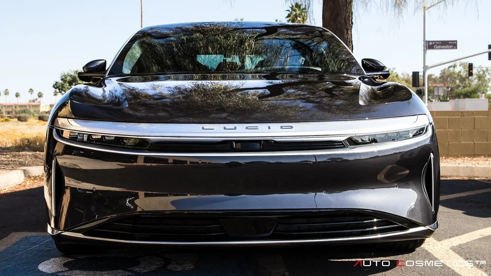 Detailer evaluating a vehicle for ceramic coating at Auto Cosmetics in Chandler, Arizona