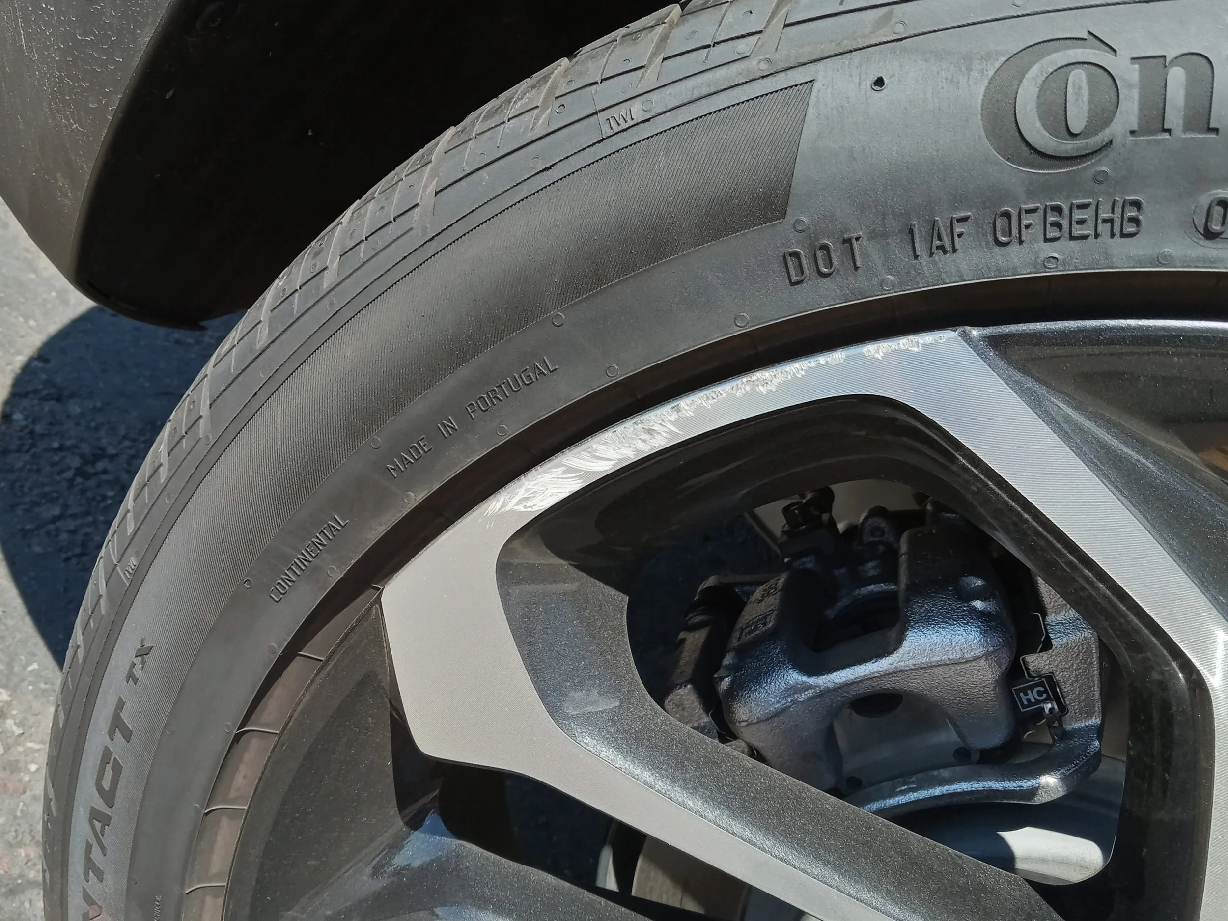 Wheel with severe curb rash damage before cosmetic rim repair