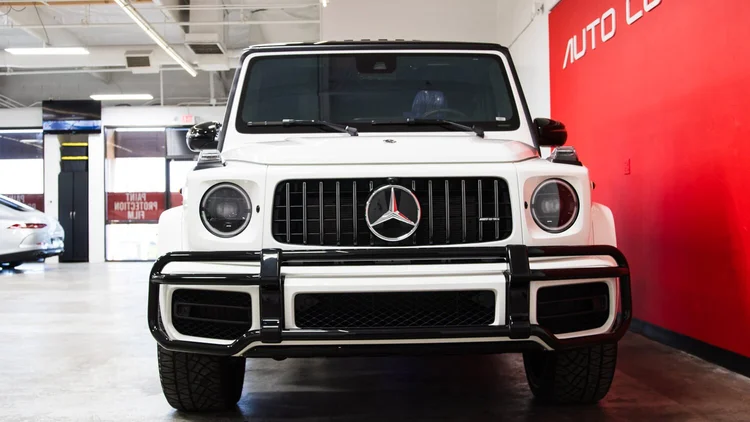 Professional paint protection film installation at Auto Cosmetics climate-controlled facility in Chandler, Arizona