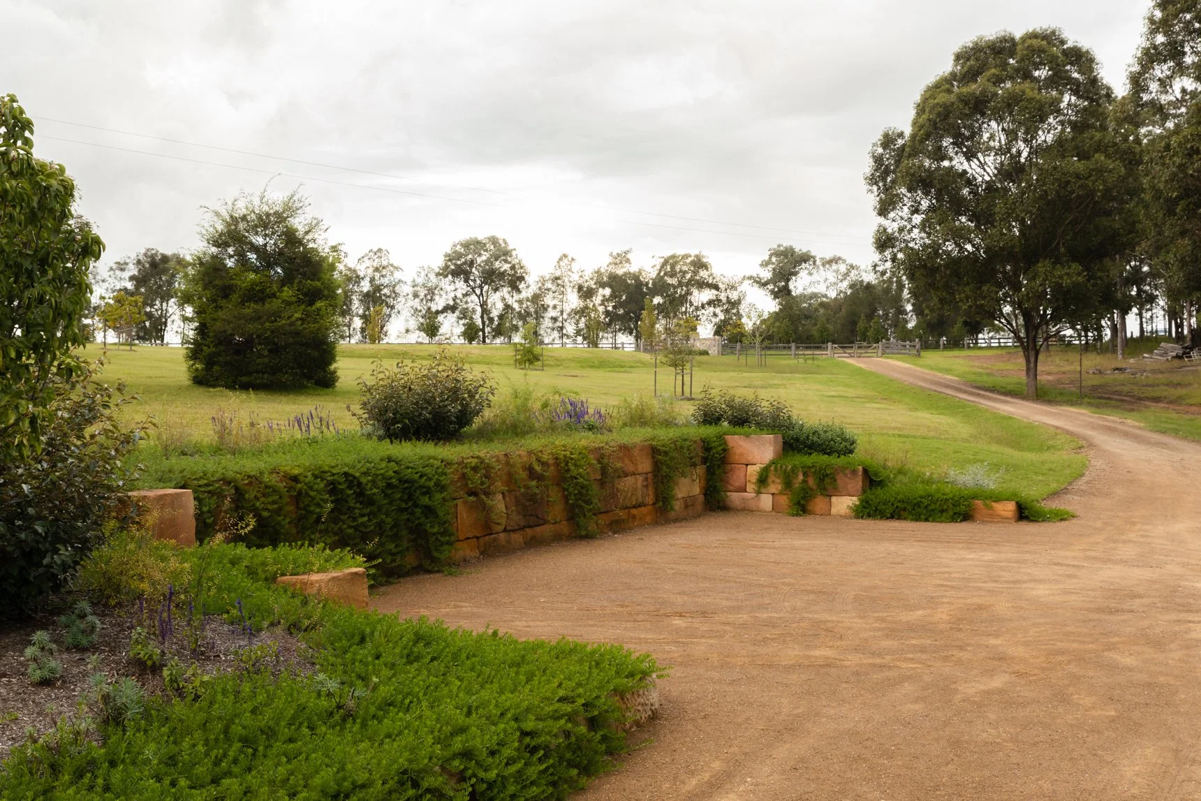 Home builders Hunter Valley garden pathway with stone retaining wall.