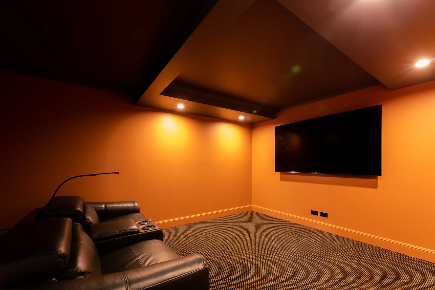 Custom houses Hunter Valley home theatre with leather seating and screen.