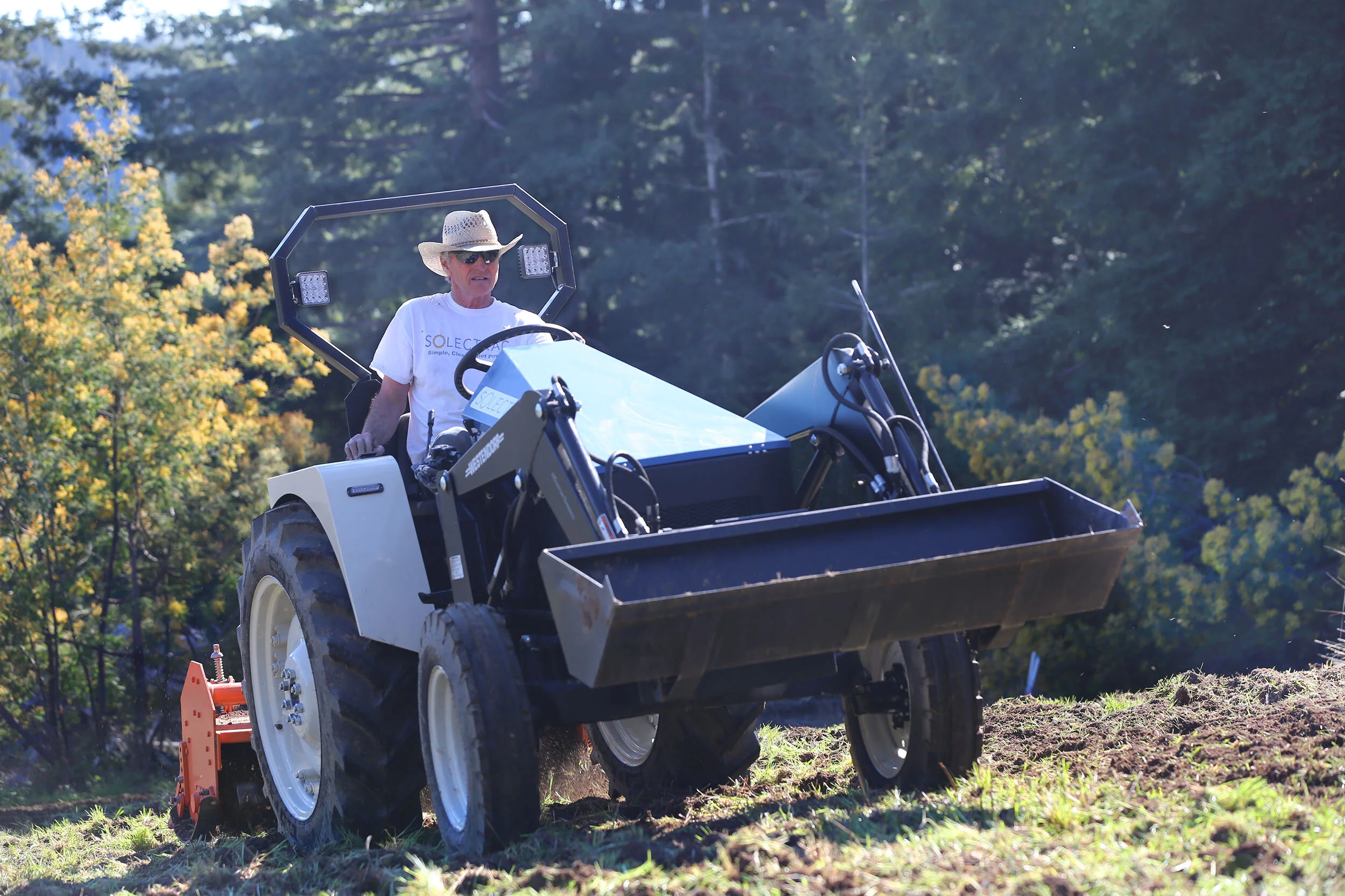 Tilling a field with the eUtility Electric Tractor
