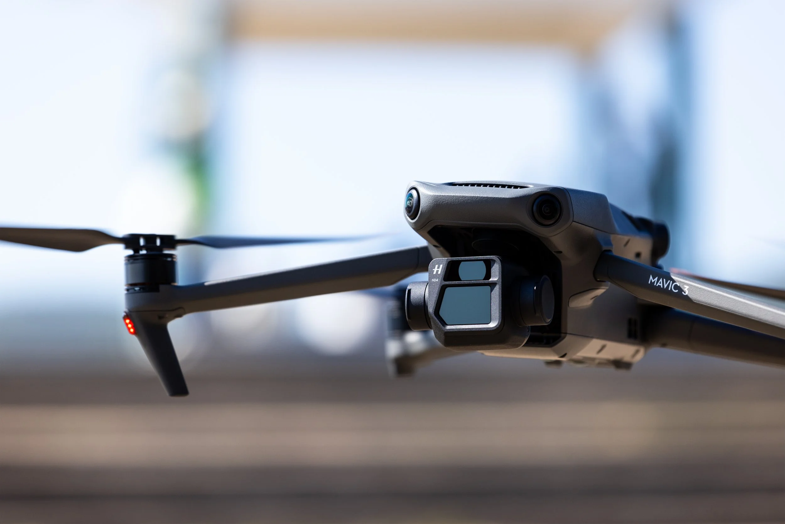 Close-up of a DJI Mavic 3 camera drone on a reflective surface