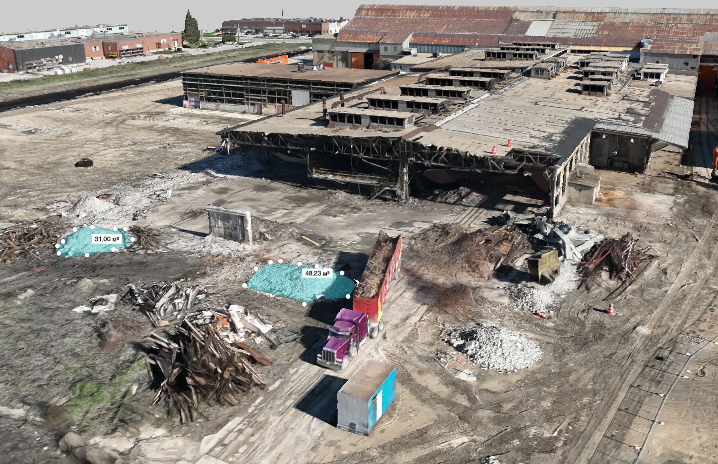 Aerial view of a construction site with partially demolished building, debris, and water meters marked with measurements.