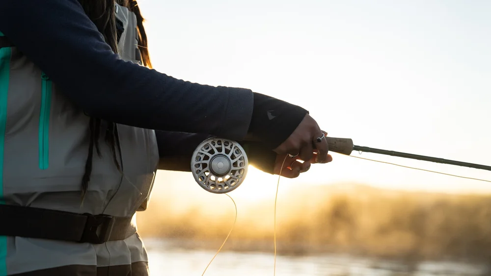 fly fishing fisherman connecting with nature through food