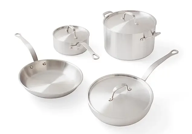 Set of five stainless steel cookware pieces, including three pots with lids and two frying pans without lids.