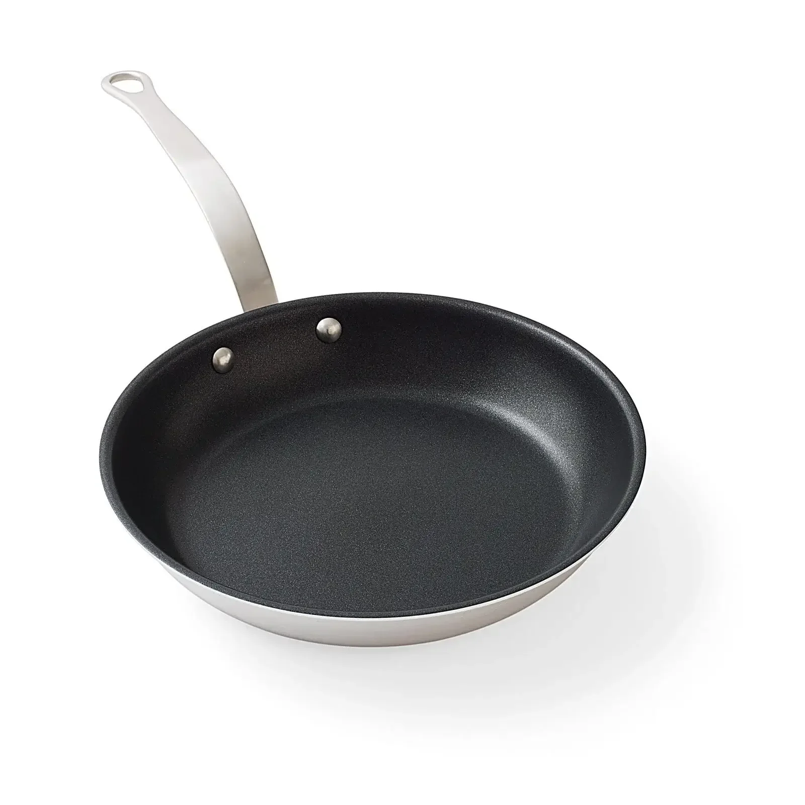Empty black frying pan with a metal handle on a white background.