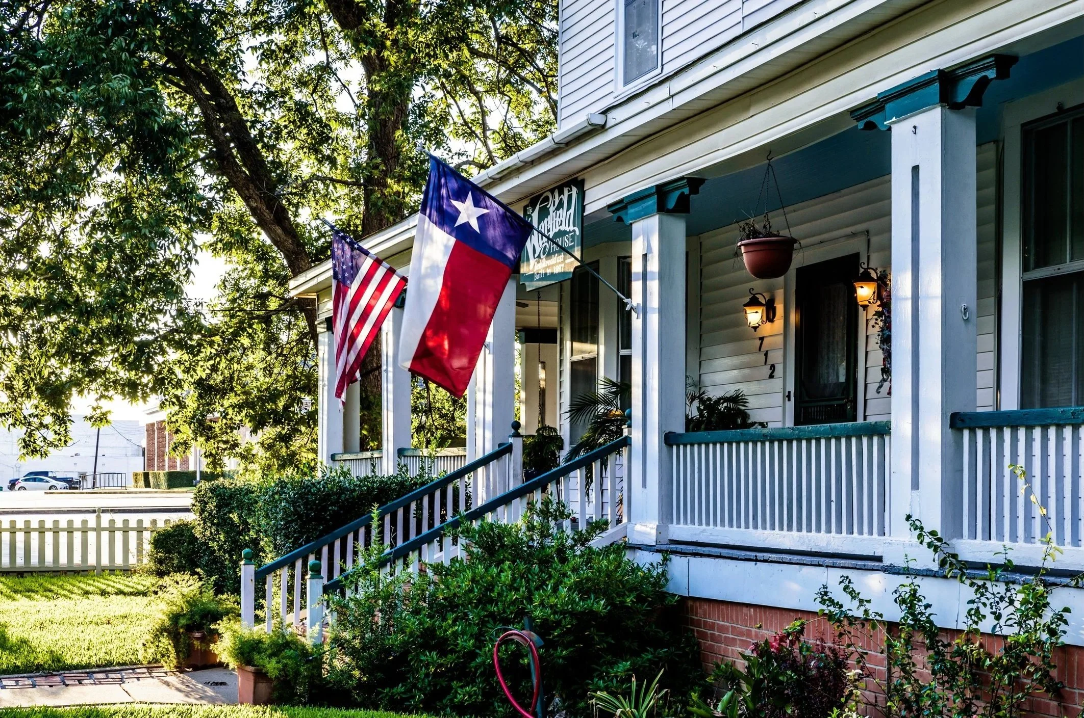Texas home with front porch and flag